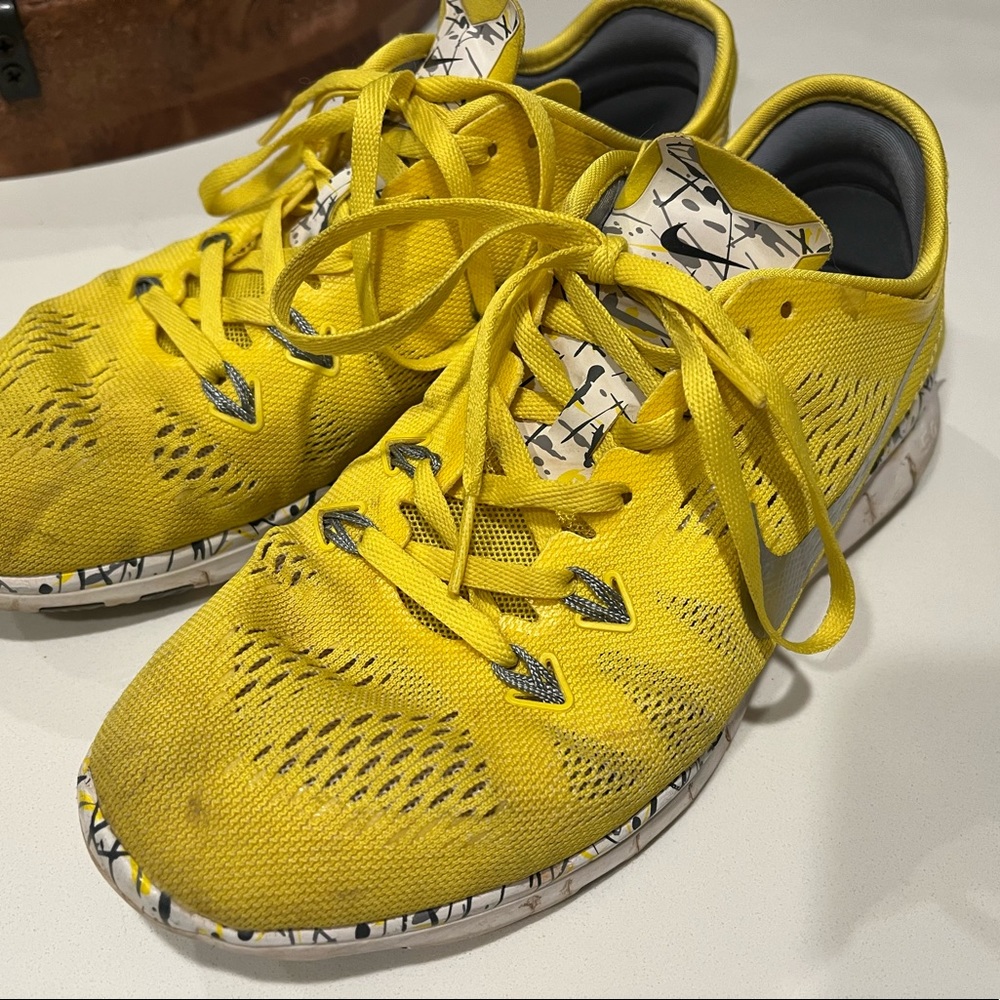 Yellow, white and gray Nike Free Run 5.0 sneakers
